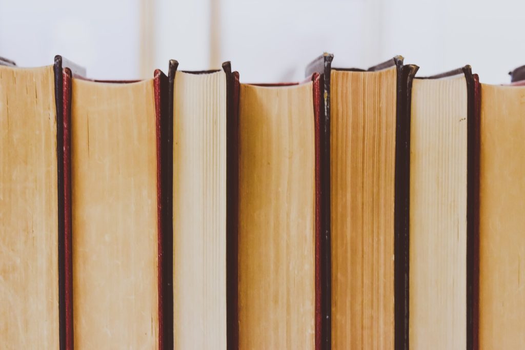 recycling books in bin